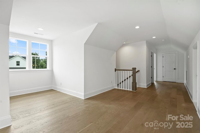 13605 Tranquil Day Dr, Matthews, NC 28105 - bonus room featuring wood finished floors, vaulted ceiling, and recessed lighting