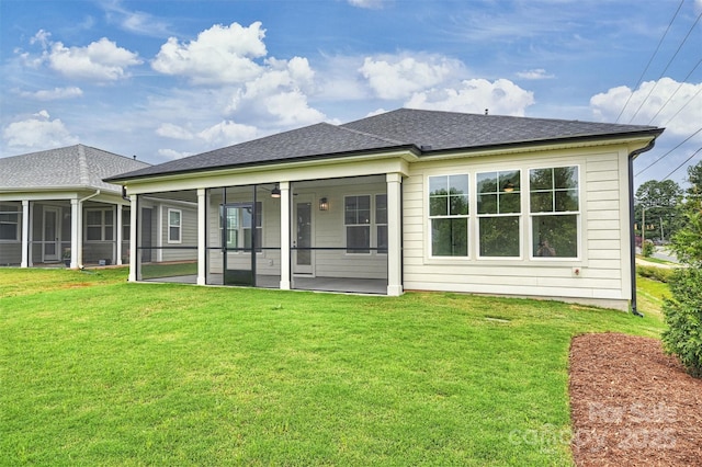 13605 Tranquil Day Dr, Matthews, NC 28105 - back of property with a sunroom, a yard, and roof with shingles