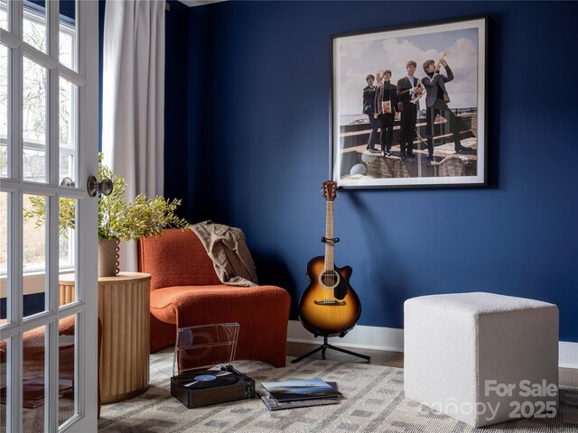 sitting room featuring baseboards