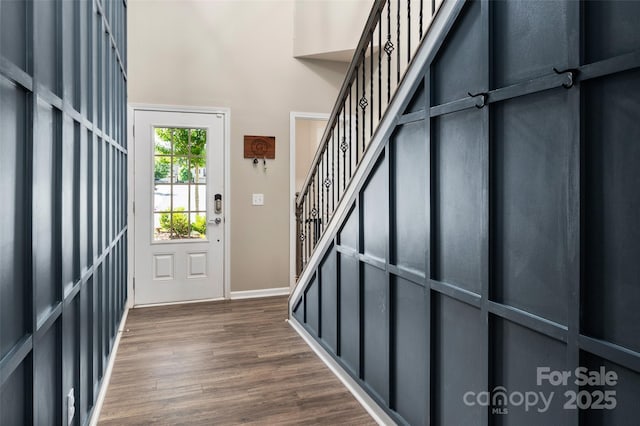 5014 Forest Hills Pl, Fort Mill, SC 29707 - entrance foyer featuring dark wood-type flooring, a towering ceiling, baseboards, and stairs