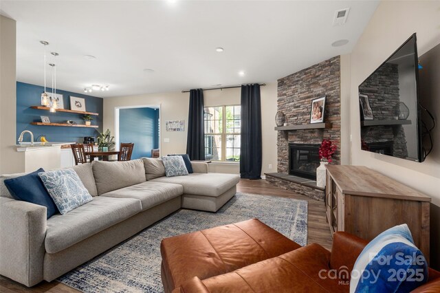 5014 Forest Hills Pl, Fort Mill, SC 29707 - living area with a stone fireplace, wood finished floors, and recessed lighting