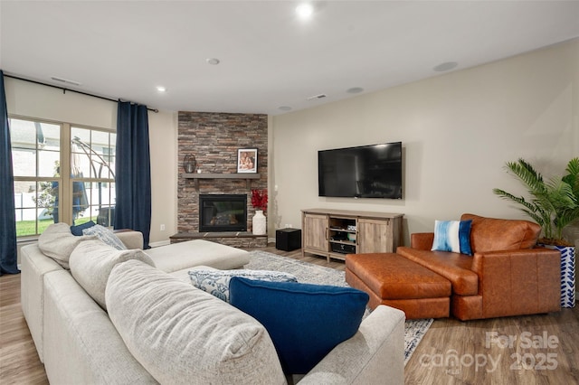 5014 Forest Hills Pl, Fort Mill, SC 29707 - living area featuring light wood-style floors and a stone fireplace