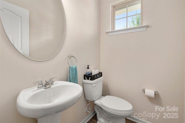 5014 Forest Hills Pl, Fort Mill, SC 29707 - bathroom with toilet, baseboards, a sink, and wood finished floors