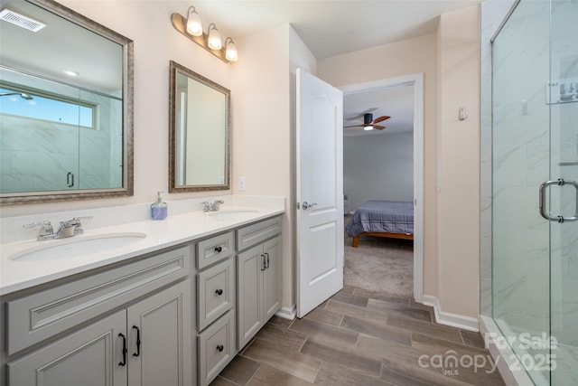 5014 Forest Hills Pl, Fort Mill, SC 29707 - ensuite bathroom featuring a marble finish shower, double vanity, a ceiling fan, and baseboards