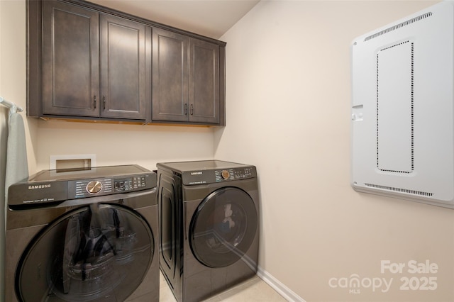 5014 Forest Hills Pl, Fort Mill, SC 29707 - laundry area with cabinet space, washer and dryer, and baseboards
