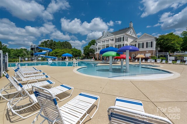 5014 Forest Hills Pl, Fort Mill, SC 29707 - community pool with a water slide, a water play area, and fence