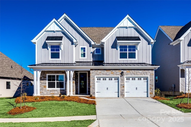 18011 Wilbanks Dr, Charlotte, NC 28278 - view of front of home featuring board and batten siding, stone siding, a standing seam roof, concrete driveway, and an attached garage