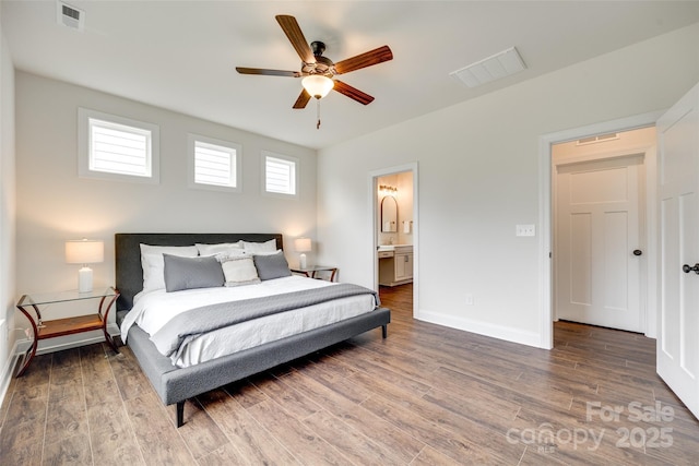 18011 Wilbanks Dr, Charlotte, NC 28278 - bedroom with wood finished floors, baseboards, ensuite bathroom, and a ceiling fan
