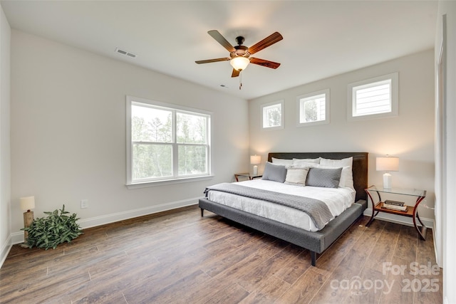18011 Wilbanks Dr, Charlotte, NC 28278 - bedroom featuring wood finished floors, baseboards, and a ceiling fan