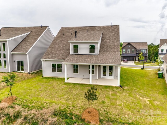 18011 Wilbanks Dr, Charlotte, NC 28278 - back of house with roof with shingles, a lawn, and a patio