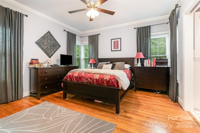 408 Idlewood Dr, Kannapolis, NC 28083 - bedroom with multiple windows, ornamental molding, light wood finished floors, and a ceiling fan