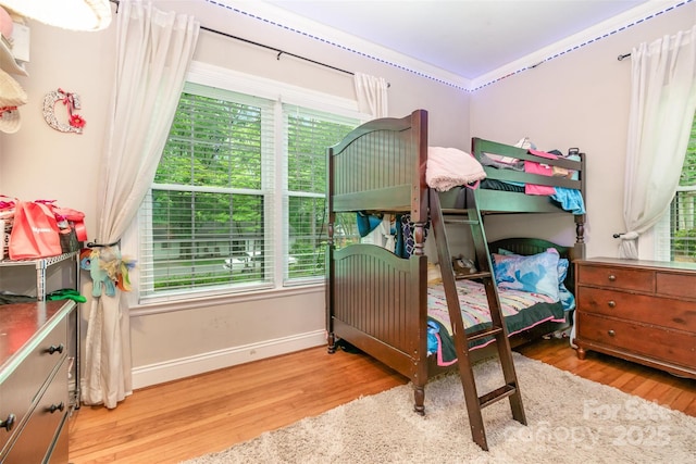 408 Idlewood Dr, Kannapolis, NC 28083 - bedroom with wood finished floors, multiple windows, and baseboards