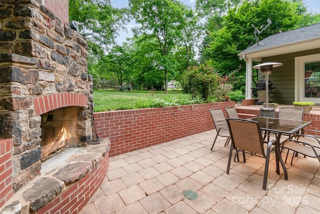 408 Idlewood Dr, Kannapolis, NC 28083 - view of patio / terrace featuring an outdoor stone fireplace and outdoor dining space
