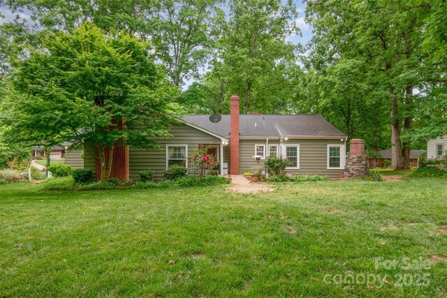 408 Idlewood Dr, Kannapolis, NC 28083 - rear view of house with a lawn and a chimney