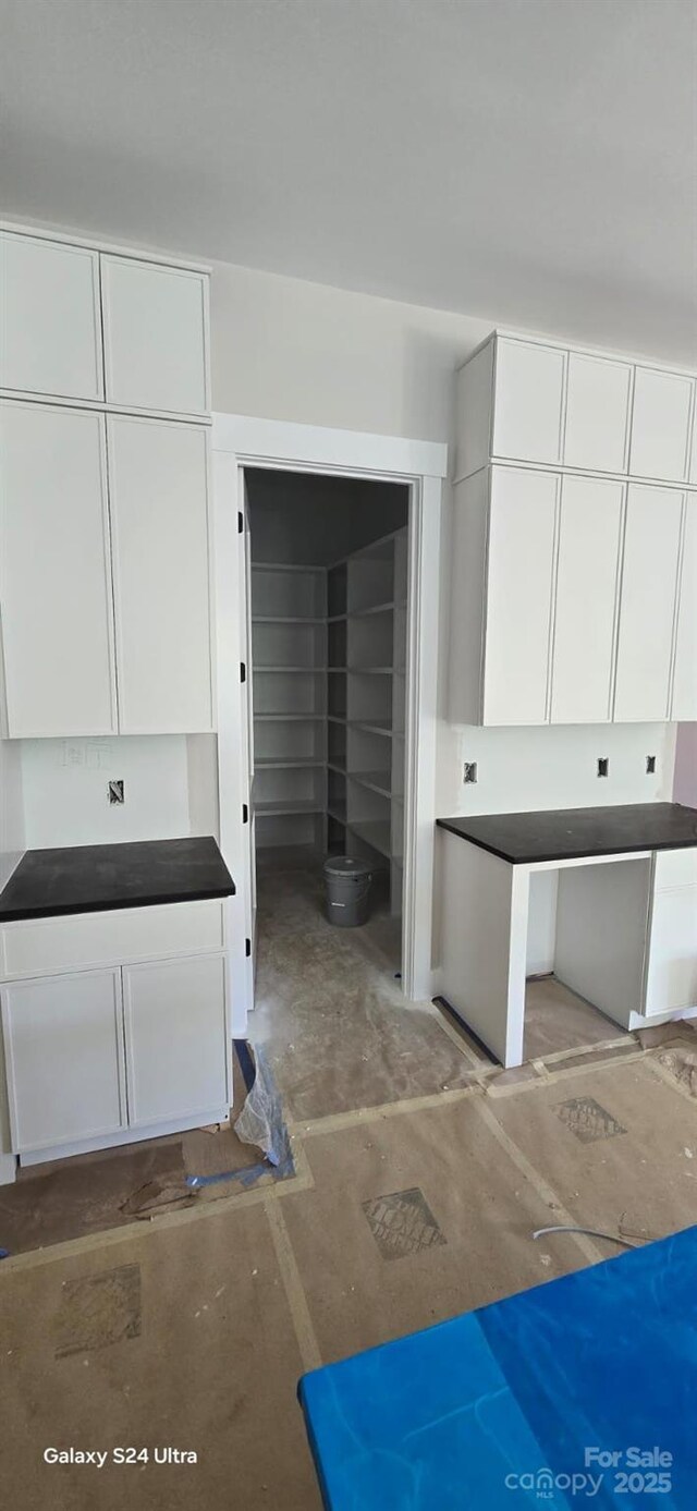 bathroom featuring concrete floors