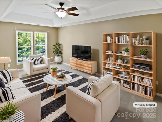 903 Furman Ct, Fort Mill, SC 29708 - living area featuring a tray ceiling, a ceiling fan, carpet, and baseboards