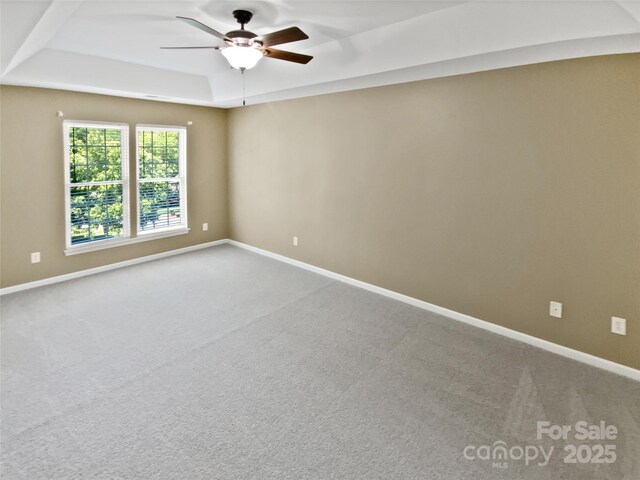 903 Furman Ct, Fort Mill, SC 29708 - empty room featuring carpet, a raised ceiling, a ceiling fan, and baseboards