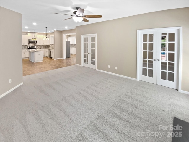 903 Furman Ct, Fort Mill, SC 29708 - unfurnished living room with french doors, ceiling fan, baseboards, light colored carpet, and recessed lighting