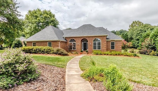 1337 Braeburn Rd NW, Concord, NC 28027 - view of front facade featuring a front yard and brick siding