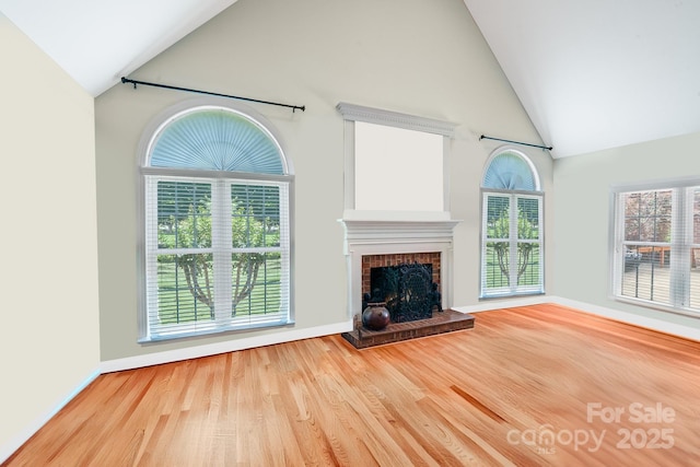 1337 Braeburn Rd NW, Concord, NC 28027 - unfurnished living room with high vaulted ceiling, wood finished floors, a fireplace, and baseboards
