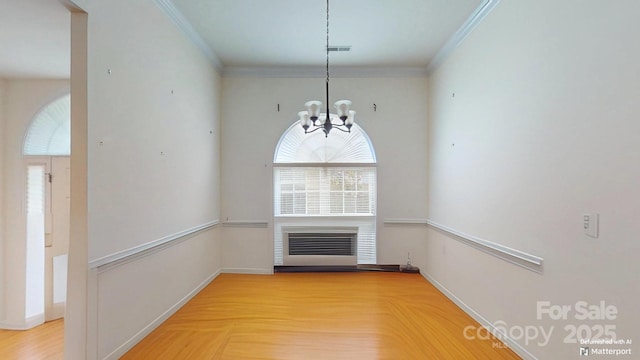 1337 Braeburn Rd NW, Concord, NC 28027 - unfurnished dining area with a fireplace, a chandelier, ornamental molding, and baseboards