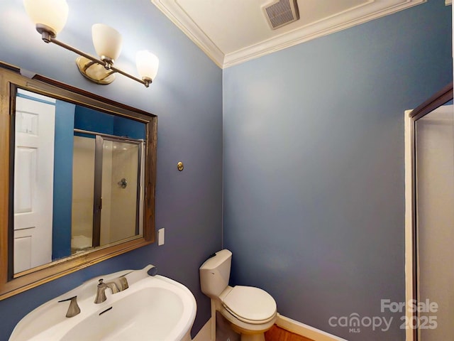 1337 Braeburn Rd NW, Concord, NC 28027 - full bath featuring a sink, toilet, ornamental molding, and a shower stall