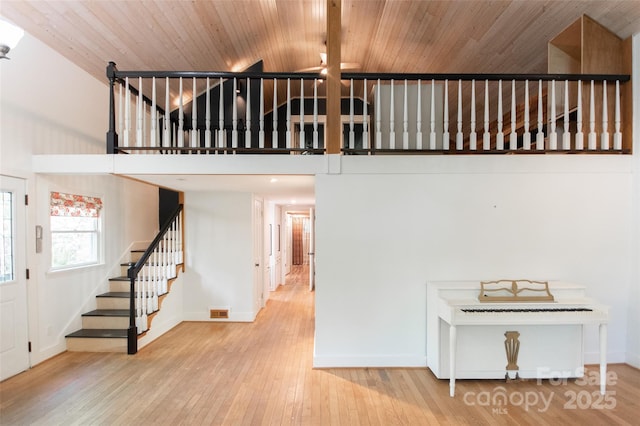 37 Geneva Cir Unit 1/2, Franklin, NC 28734 - stairs featuring a towering ceiling, hardwood / wood-style flooring, and wood ceiling
