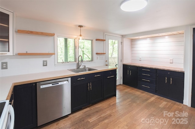 37 Geneva Cir Unit 1/2, Franklin, NC 28734 - kitchen featuring dishwasher, open shelves, dark cabinets, light wood-style floors, and light countertops