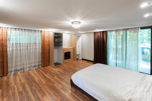 37 Geneva Cir Unit 1/2, Franklin, NC 28734 - bedroom with a fireplace and wood finished floors