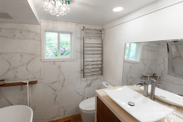 37 Geneva Cir Unit 1/2, Franklin, NC 28734 - bathroom featuring radiator heating unit, tile walls, a towel warming rack, vanity, and a chandelier