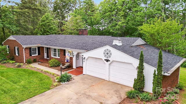 200 Woodside Dr, Morganton, NC 28655 - ranch-style house with a chimney, a shingled roof, asphalt driveway, and a garage