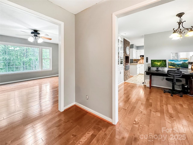 200 Woodside Dr, Morganton, NC 28655 - corridor with light wood-style floors, baseboards, a chandelier, and an office area