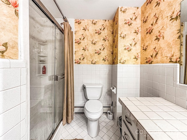 200 Woodside Dr, Morganton, NC 28655 - bathroom featuring wallpapered walls, a wainscoted wall, a baseboard heating unit, a shower stall, and tile patterned floors