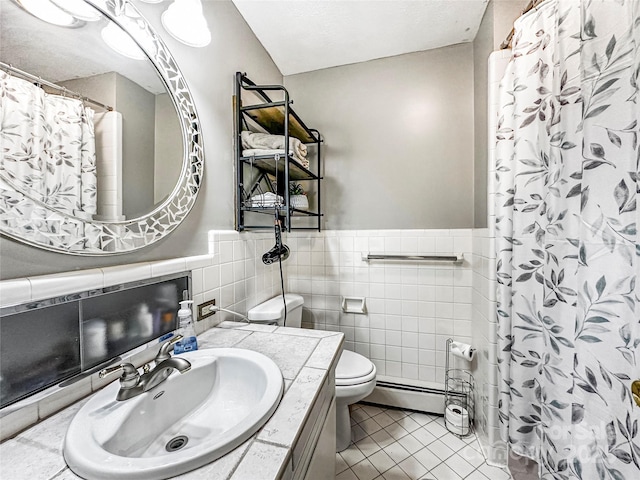 200 Woodside Dr, Morganton, NC 28655 - full bath with toilet, tile patterned floors, tile walls, a wainscoted wall, and a baseboard heating unit