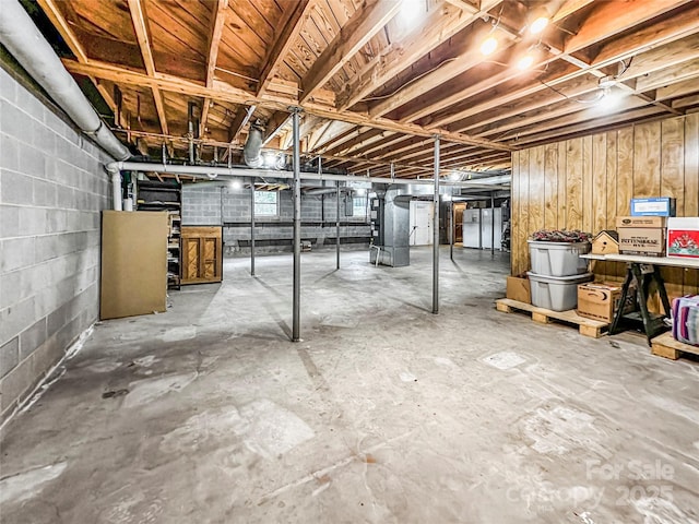 200 Woodside Dr, Morganton, NC 28655 - unfinished below grade area with heating unit and concrete block wall