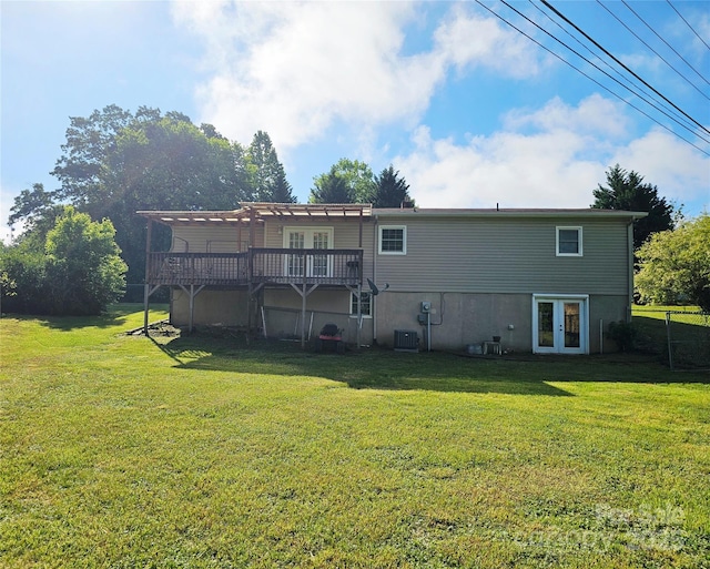 rear view of house featuring french doors, a yard, a pergola, and a wooden deck