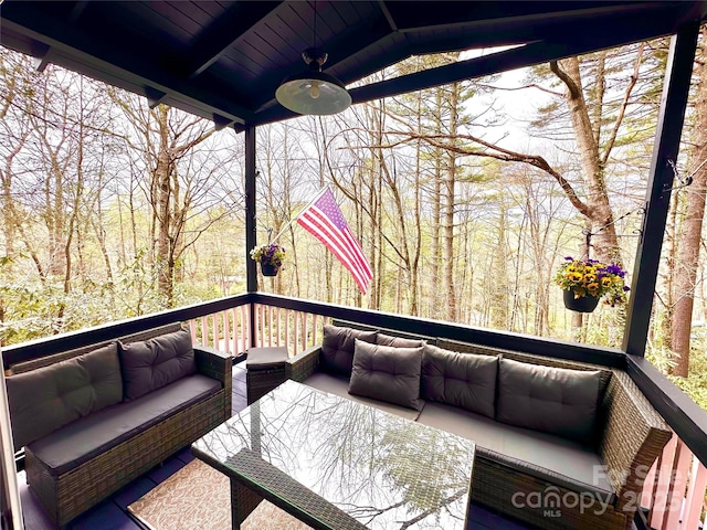 deck featuring an outdoor living space and ceiling fan