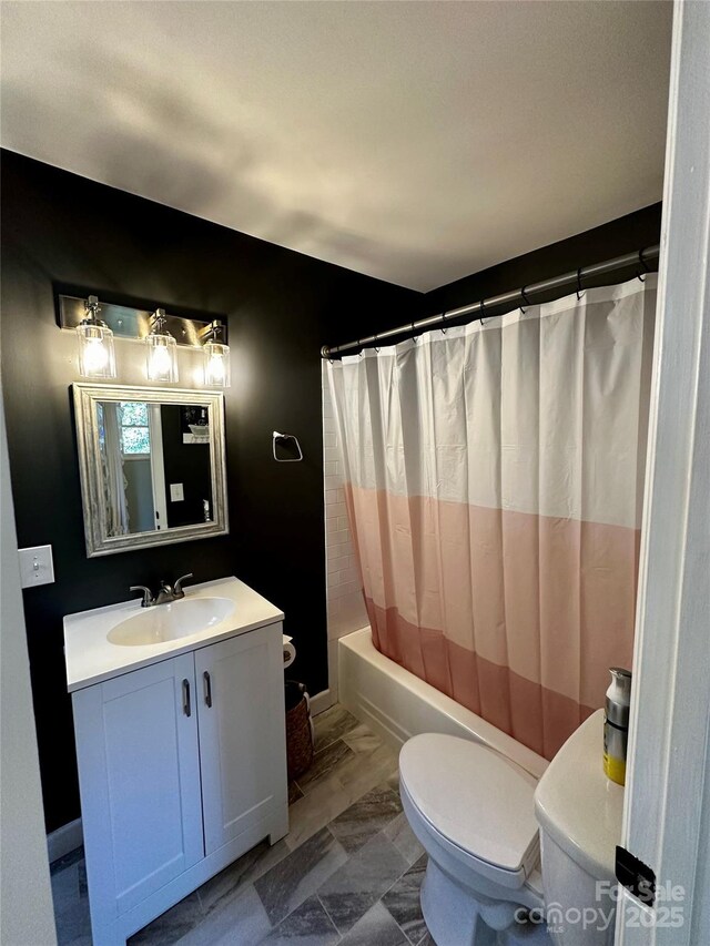 full bathroom with toilet, vanity, shower / bath combination with curtain, and marble look tiles