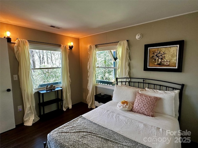 bedroom featuring wood finished floors