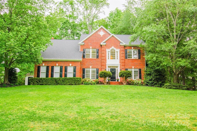 12314 Chickasaw Dr, Huntersville, NC 28078 - view of front facade with brick siding and a front yard