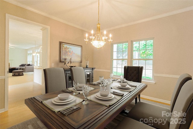 12314 Chickasaw Dr, Huntersville, NC 28078 - dining area featuring a chandelier, crown molding, baseboards, and wood finished floors