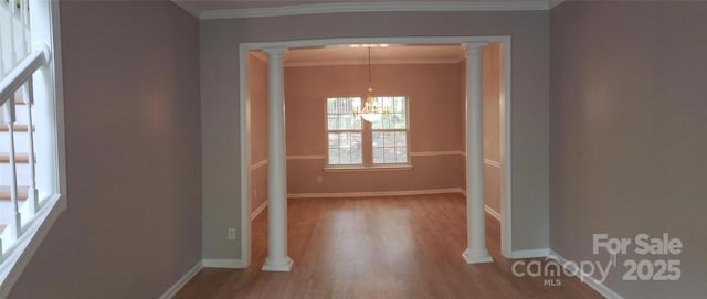 12314 Chickasaw Dr, Huntersville, NC 28078 - corridor with a chandelier, wood finished floors, ornamental molding, baseboards, and decorative columns