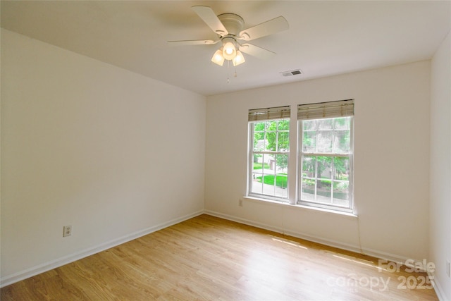 12314 Chickasaw Dr, Huntersville, NC 28078 - empty room with light wood finished floors, ceiling fan, and baseboards