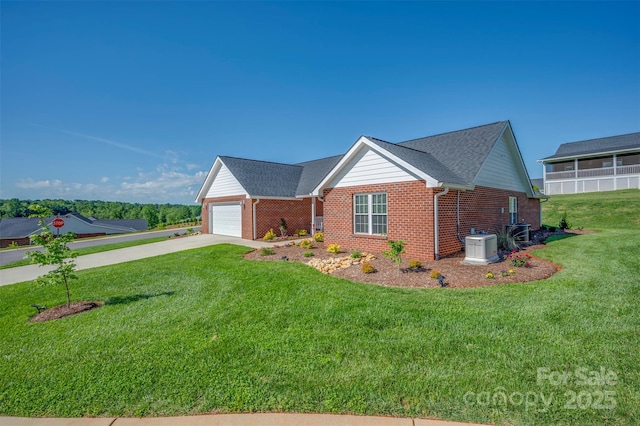 105 Kingston Pl, Spindale, NC 28160 - view of front of home with brick siding, concrete driveway, a front yard, and an attached garage