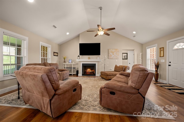 105 Kingston Pl, Spindale, NC 28160 - living area with a ceiling fan, a lit fireplace, vaulted ceiling, wood finished floors, and baseboards