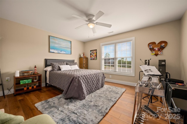 105 Kingston Pl, Spindale, NC 28160 - bedroom with wood finished floors, ceiling fan, and baseboards