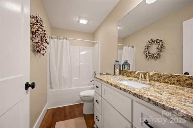 105 Kingston Pl, Spindale, NC 28160 - bathroom with wood finished floors, vanity, toilet, shower / tub combo with curtain, and baseboards