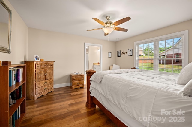 105 Kingston Pl, Spindale, NC 28160 - bedroom featuring wood finished floors, baseboards, ensuite bath, and a ceiling fan