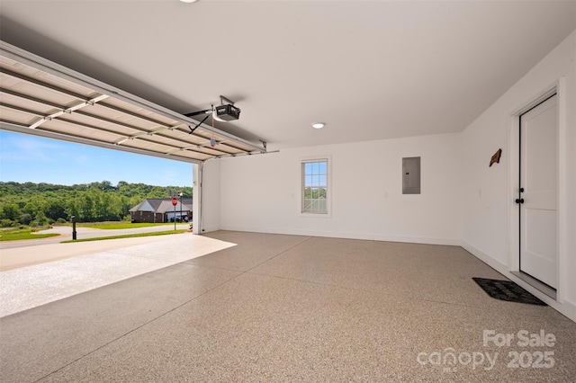 105 Kingston Pl, Spindale, NC 28160 - garage with electric panel, a garage door opener, and baseboards