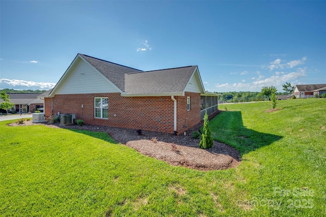 105 Kingston Pl, Spindale, NC 28160 - view of side of home featuring brick siding, central AC, a yard, and a shingled roof